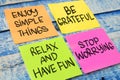 Enjoy simple things be grateful relax have fun stop worrying, text words typography written on paper, life and business