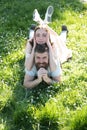 Enjoy summer vacation. Happy couple relax on sunny outdoor. Sensual woman lying on bearded man on green grass. Carefree Royalty Free Stock Photo