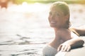 Enjoy the summer. Woman relaxing in the pool water