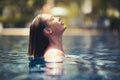 Enjoy the summer. Woman relaxing in the pool water Royalty Free Stock Photo