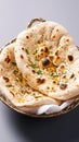 Enjoy Tandoori naan, a classic accompaniment to Indian dishes.