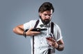 enjoy the taste. bearded man in suspenders drink red wine. brutal guy bartender in bow tie. elegant male barman Royalty Free Stock Photo