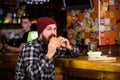 Enjoy taste of fresh burger. Hipster hungry man eat burger. Man with beard eat burger menu. Brutal hipster bearded man