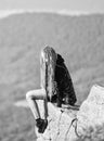 Enjoy the view. Tourist hiker girl relaxing edge cliff. Dangerous relax. Extreme concept. On edge of world. Woman sit on Royalty Free Stock Photo