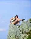 Enjoy the view. Tourist hiker girl relaxing edge cliff. Dangerous relax. Extreme concept. On edge of world. Woman sit on Royalty Free Stock Photo