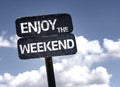 Enjoy the Weekend sign with clouds and sky background Royalty Free Stock Photo