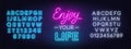 Enjoy Your Life neon lettering on brick wall background. Royalty Free Stock Photo