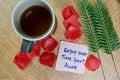 Enjoy Your Time Spent Alone write on sticky notes isolated on Wooden Table Royalty Free Stock Photo