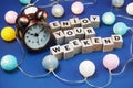 Enjoy Your Weekend alphabet letter and alarm clock decorate with LED cotton ball on blue background