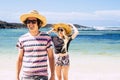 Enjoyed couple of young happy tourists at the beach. Boy and girl smile and have fun in tropical summer holiday vacation. Blue Royalty Free Stock Photo