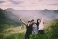 Enjoying camping in nature,Group of feiends lover standing with hands raise up and looking beautiful view feeling happy and smilin Royalty Free Stock Photo