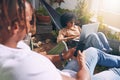 Enjoying a chilled afternoon with their connections. a young woman using a laptop and relaxing on a hammock while her Royalty Free Stock Photo