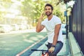 Enjoying the city the modern way. Shot of a young handsome man spending the day in the city. Royalty Free Stock Photo