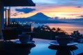 Enjoying coffee at sunset with Mount Agung in background Royalty Free Stock Photo