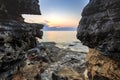 Enjoying the colorful sunset on a beach with rocks on the Adriatic Sea coast Istria Croatia Royalty Free Stock Photo