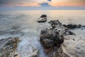 Enjoying the colorful sunset on a beach with rocks on the Adriatic Sea coast Istria Croatia Royalty Free Stock Photo