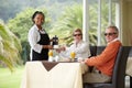 Enjoying a delicious breakfast. a senior couple being served in the hotel restaurant. Royalty Free Stock Photo