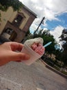 Enjoying a delicious and fresh ice cream with a guamisha and garambullo flavor in the magical town Mineral de Pozos with cobbled s Royalty Free Stock Photo