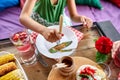 Enjoying dinner child girl eat with knife and fork, dinner table