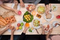 Enjoying dinner with friends. Top view of group of people havin Royalty Free Stock Photo