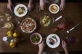 Enjoying dinner with friends. Top view of group of people having Royalty Free Stock Photo