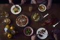 Enjoying dinner with friends. Top view of group of people having Royalty Free Stock Photo