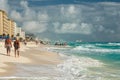 Enjoying an early morning stroll on the sandy beach Royalty Free Stock Photo