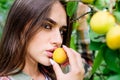 Enjoying eating apricot. natural cosmetics. perfect skin. fashion makeup beauty. juicy fruit. sexy girl. woman near