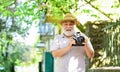 Enjoying free time. Travel and tourism. Capturing beauty. Senior man hold camera. Retirement travel. Spring holidays