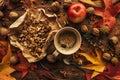 Enjoying fruits of autumn - apple, coffee and walnut on table