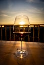 Enjoying a glass of red wine at sunset Royalty Free Stock Photo