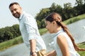 Enjoying great time with father. Back view of happy young father and daughter holding hands and smiling while walking Royalty Free Stock Photo