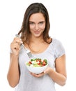 Enjoying a healthy snack. Portrait of a young woman enjoying a fresh salad. Royalty Free Stock Photo