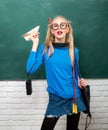 Enjoying her school life. Fancy schoolgirl. School fashion. Carefree teenager. Fashionable blonde girl chalkboard