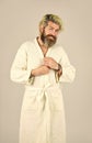 Enjoying his morning. handsome guy at the morning. bearded man wear white terry bathrobe sleeping in hotel bedroom. bed Royalty Free Stock Photo