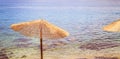 Enjoying the holiday: Sunshade and clear water, beach, Croatia