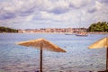 Enjoying the holiday: Sunshade and clear water, beach, Croatia