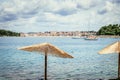 Enjoying the holiday: Sunshade and clear water, beach, Croatia