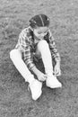 Enjoying leisure time. small girl relax on green grass. Parks and outdoor. Spring nature. Summer picnic. Small school Royalty Free Stock Photo