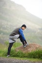 Enjoying a morning jog. A young man tying his shoe laces before a morning run in winter. Royalty Free Stock Photo