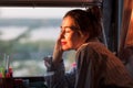 Enjoying morning sun next to her window Royalty Free Stock Photo