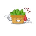 Enjoying music avocado fruit basket cartoon mascot design Royalty Free Stock Photo