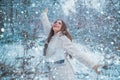 Woman in snow. Enjoying nature wintertime. Vintage winter person. Girl playing with snow in park. Beautiful young woman Royalty Free Stock Photo