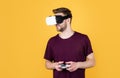 Enjoying new reality. game player with console. male in VR headset. Happy gamer use modern technology. Digital future