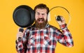 Enjoying nice weekend. brutal hipster cooking with saucepan. housekeep husband cook in pot. mature chef in checkered Royalty Free Stock Photo