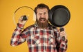 Enjoying nice weekend. brutal hipster cooking with saucepan. housekeep husband cook in pot. mature chef in checkered Royalty Free Stock Photo