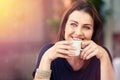 Enjoying a relaxed cuppa. a woman drinking a cup of coffee.