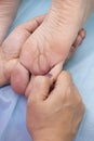 Enjoying and relaxing healthy foot massage close up, toes Royalty Free Stock Photo