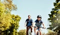 Enjoying a ride out with Dad. a young boy and his father riding together on their bicycles. Royalty Free Stock Photo