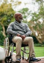 Enjoying the scenery. Full length shot of a handsome senior man sitting in his wheelchair outside. Royalty Free Stock Photo